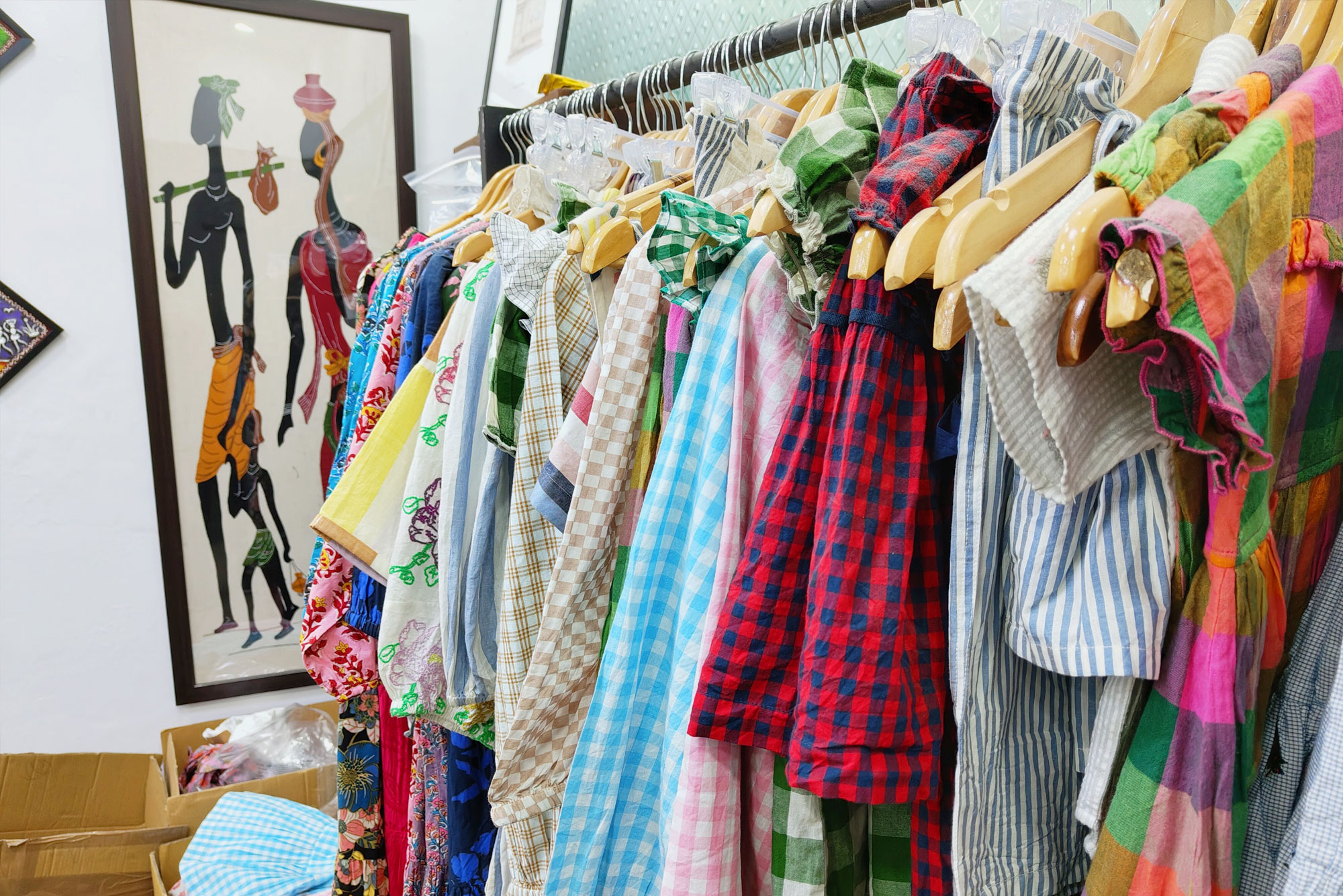 Rail of printed garments in the LRN Exports workshop